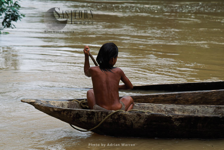 Waorani Indians, in rowing boat, Rio Cononaco, Ecuador, 1993