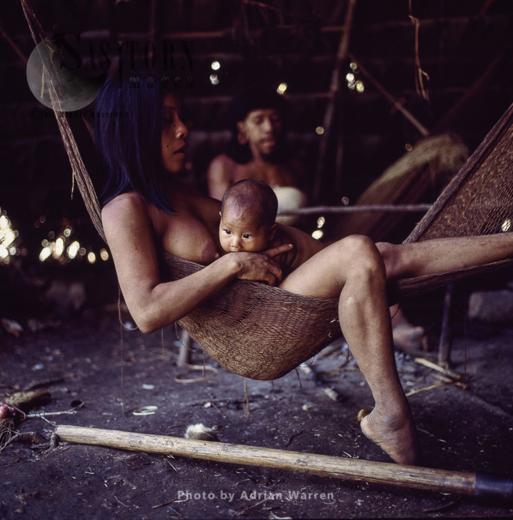 Waorani Indians, resting in hammock, Rio Cononaco, Ecuador, 1983