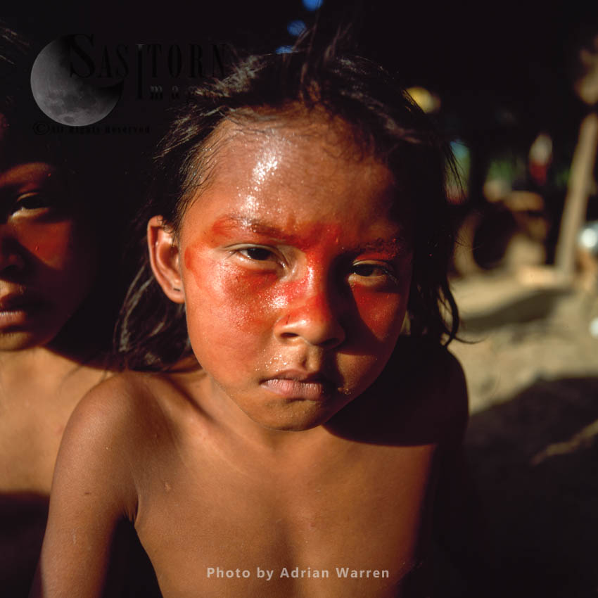Waorani Indians : children, using Achiote for decoration, Rio Cononaco, Ecuador, 2002