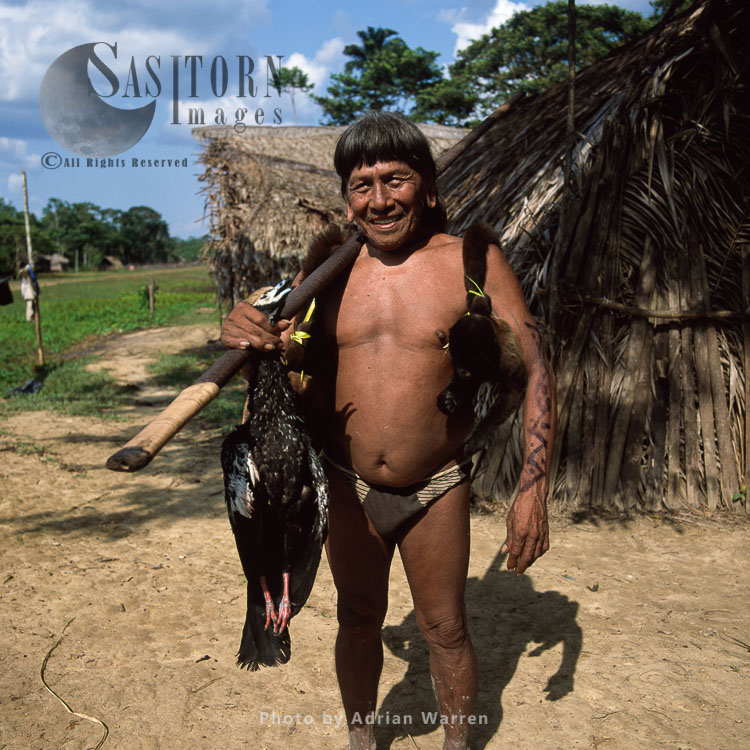 Waorani Indians : Caempaede after a sucessful hunt with Blowgun, Settlement near airstrip, rio Cononaco, Ecuador