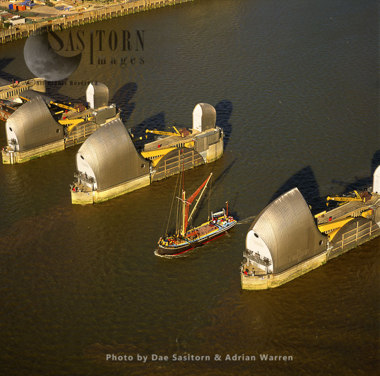 A Thames sailing barge going through the Thames Barrier, a movable barrier system designed to prevent flooding of Greater London