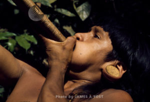 Waorani Indians, boys condition lungs, diaphragm and cheeks for effective blowgunning, Gabado, Ecuador, 1973