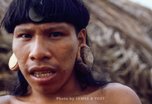 Waorani Indians, Stretching earlobes to their size in a month often causes infection and tears in the lobe, Gabado, Ecuador, 1973