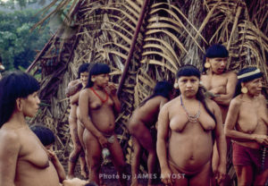 Waorani Indians: Evenings are a time for gathering outside the house and socializing, Gabado, 1973, Ecuador