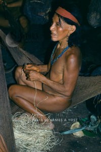 Waorani Indians: Spinning dried chambira fibers into twine fills time during socializing, Gabado, 1976, Ecuador