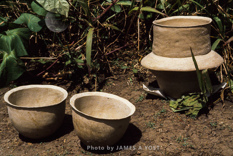 Waorani Indians: Clay drinking bowls and storage pot for valuables, like feathers, dry, awaiting firing, Kiwado, 1978, Ecuador