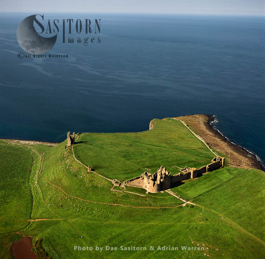 Dunstanburgh Castle, a 14th-century fortification, near Craster , Northumberland