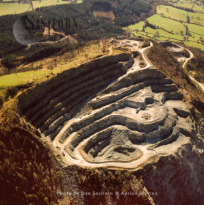 Criggion Quarry,, on Breiddon Hill, NE of Welshpool, North Wales. The quarry is a hard rock igneous deposit (basalt) mainly use in the road construction industry.