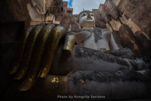 Wat Si Chum is remarkable for its huge sitting Buddha covered with stucco in Sukhothai Historical Park, Sokhothai province, Thailand.