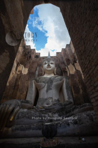 Wat Si Chum is remarkable for its huge sitting Buddha covered with stucco in Sukhothai Historical Park, Sokhothai province, Thailand.