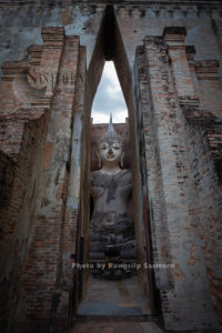  Wat Si Chum is remarkable for its huge sitting Buddha covered with stucco in Sukhothai Historical Park, Sokhothai province, Thailand.
