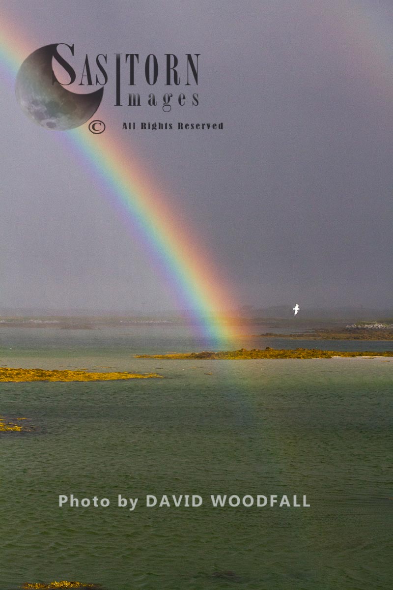 Rainbow on sea loch, Berneray, North Uist, Outer Hebrides, Scotland