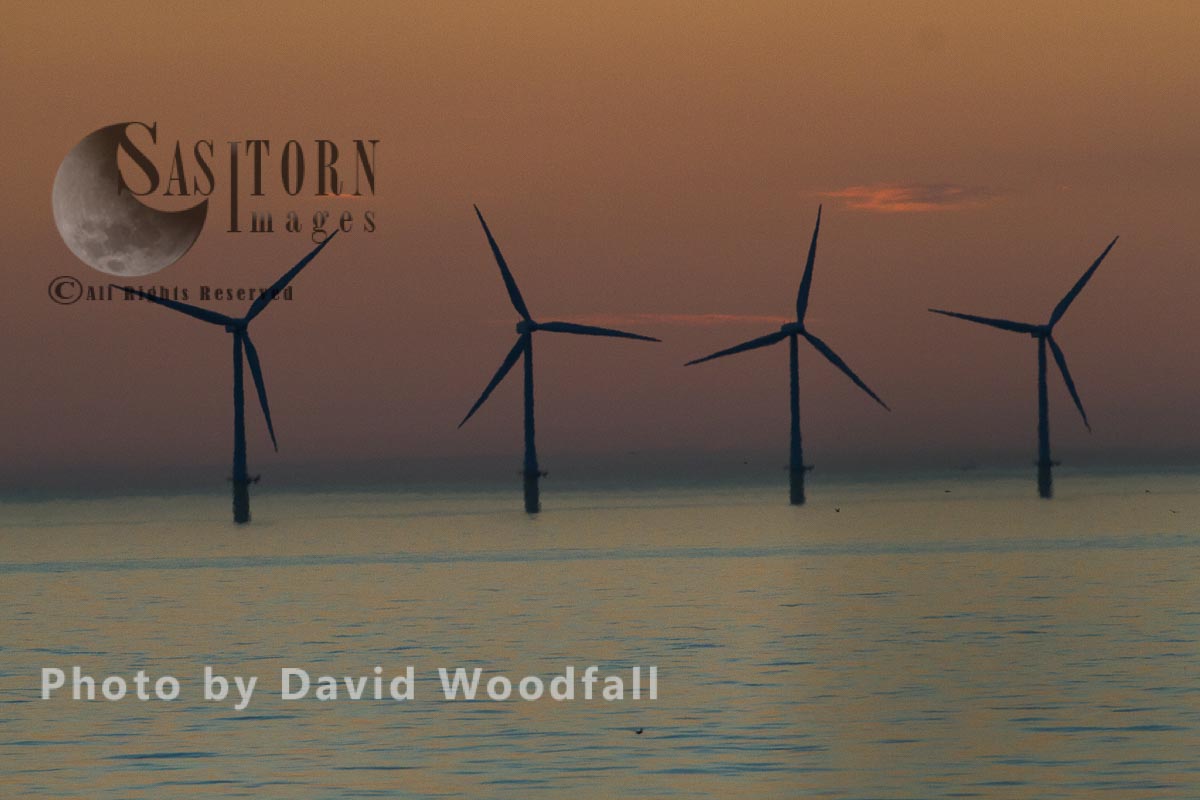 Wind Turbines, off the N orth Wales coast, generating sustainable energy.