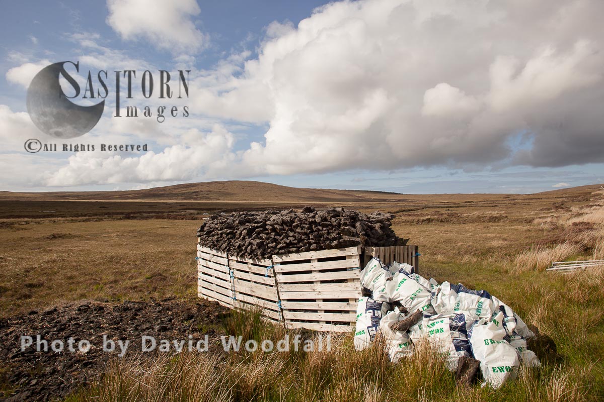 Hand dug peat in stacks, collected by hand, for domestic use on moorland. Berneray, North Uist, Outer Hebrides